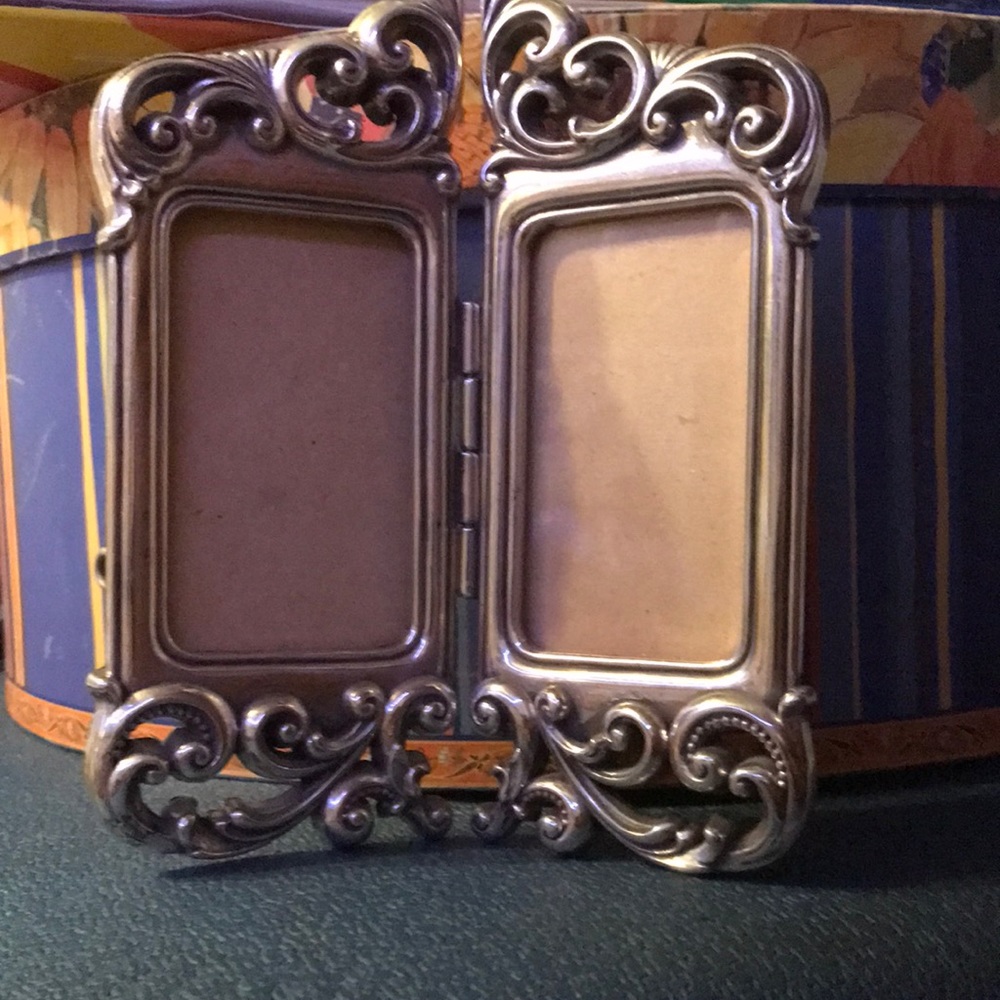 Brighton frame, silver-tone, 5.5X4.5”. Has one little hearts on back missing.